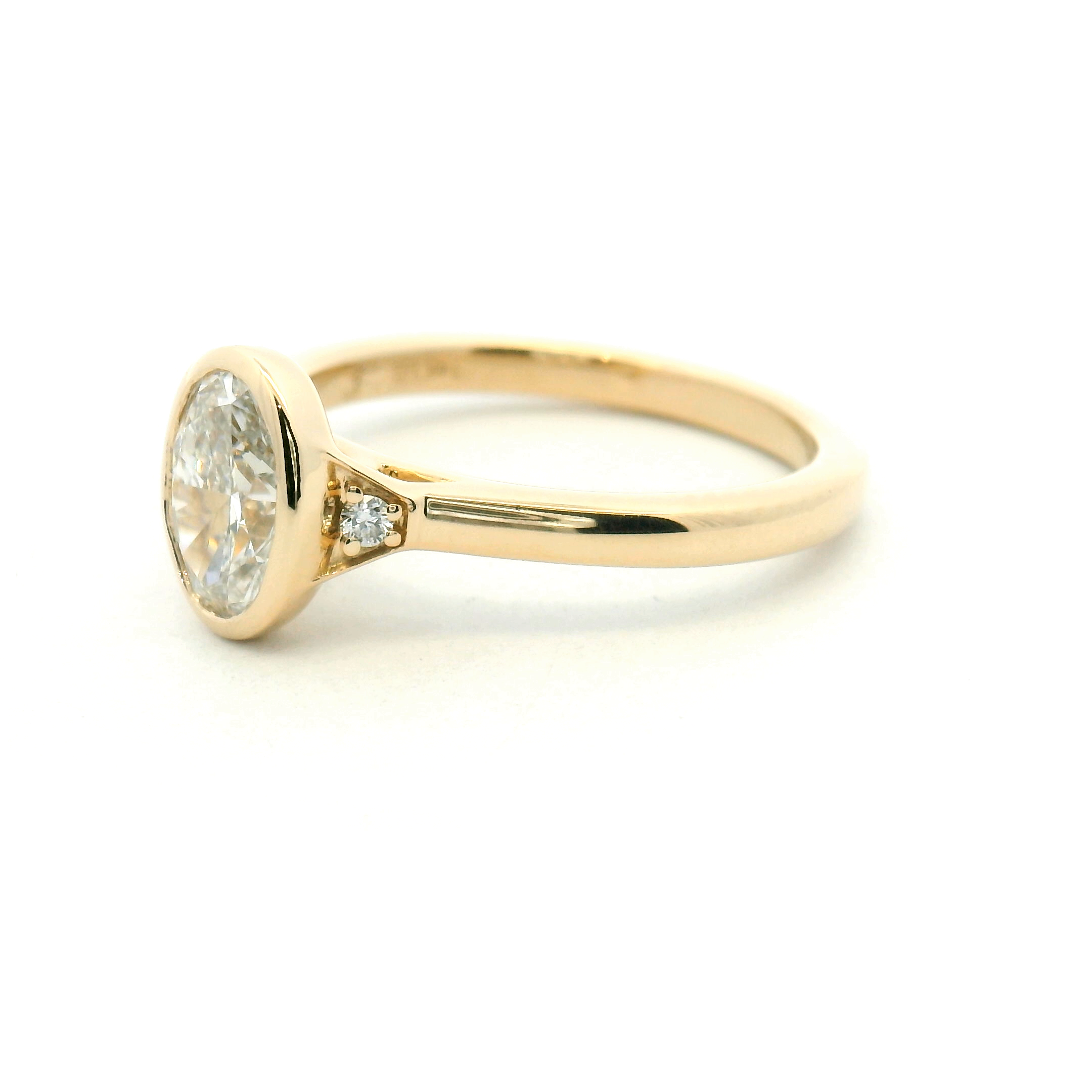 Three Stone Bezel Set Oval Diamond Engagement Ring