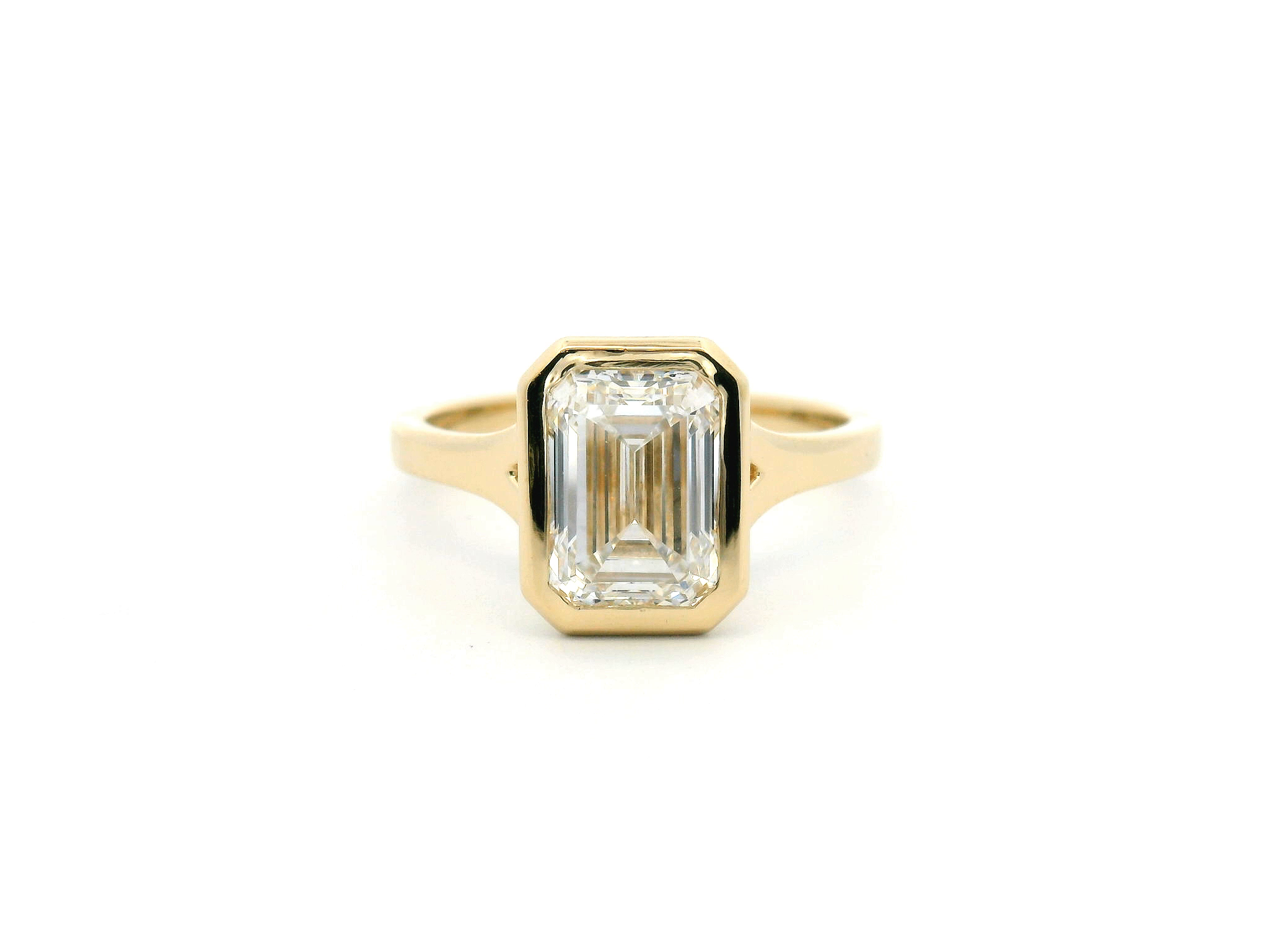 Emerald Cut Diamond Split Shank Bezel Engagement Ring