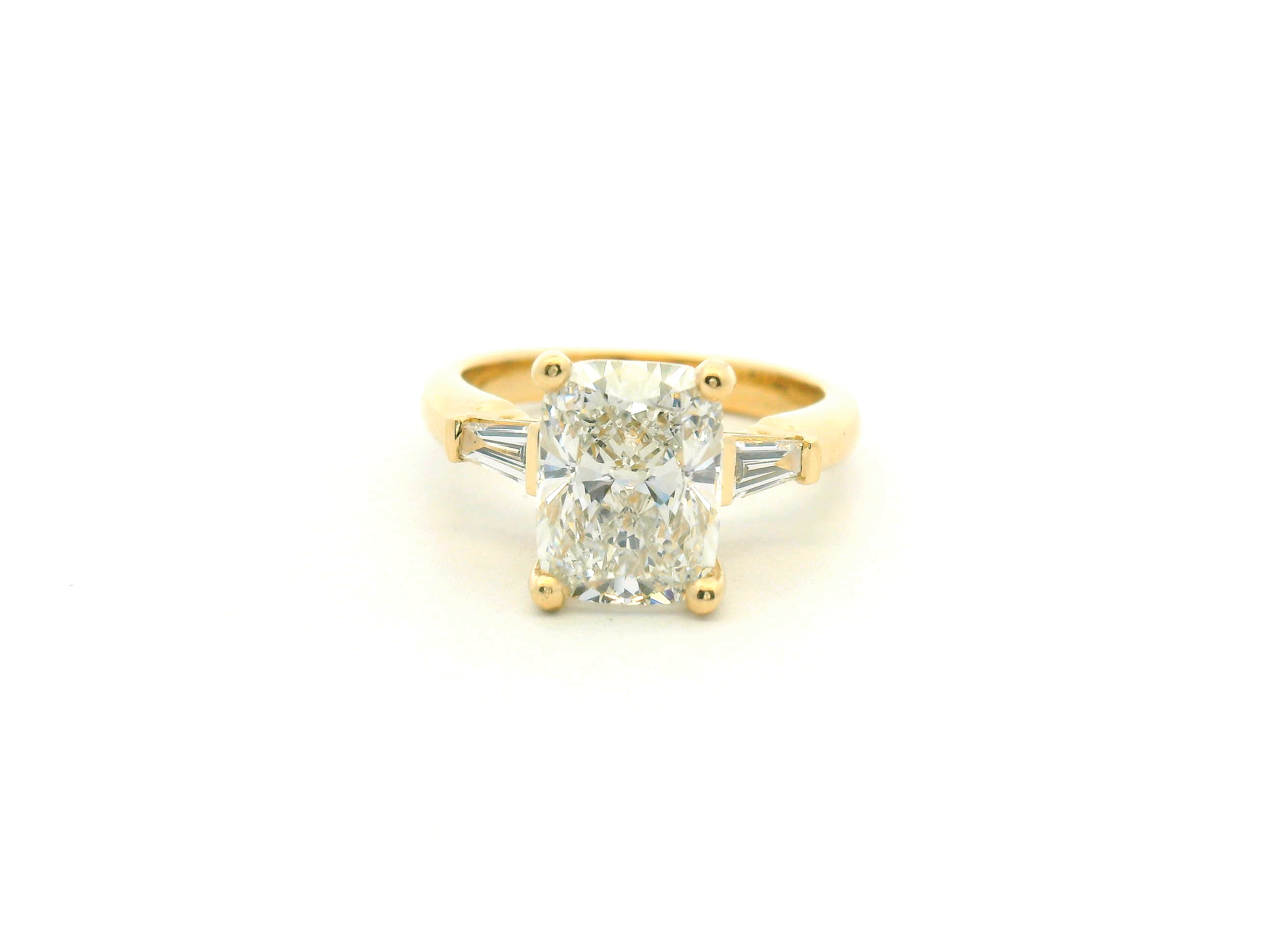 Elongated Cushion & Tapered Baguette Three-Stone Engagement Ring