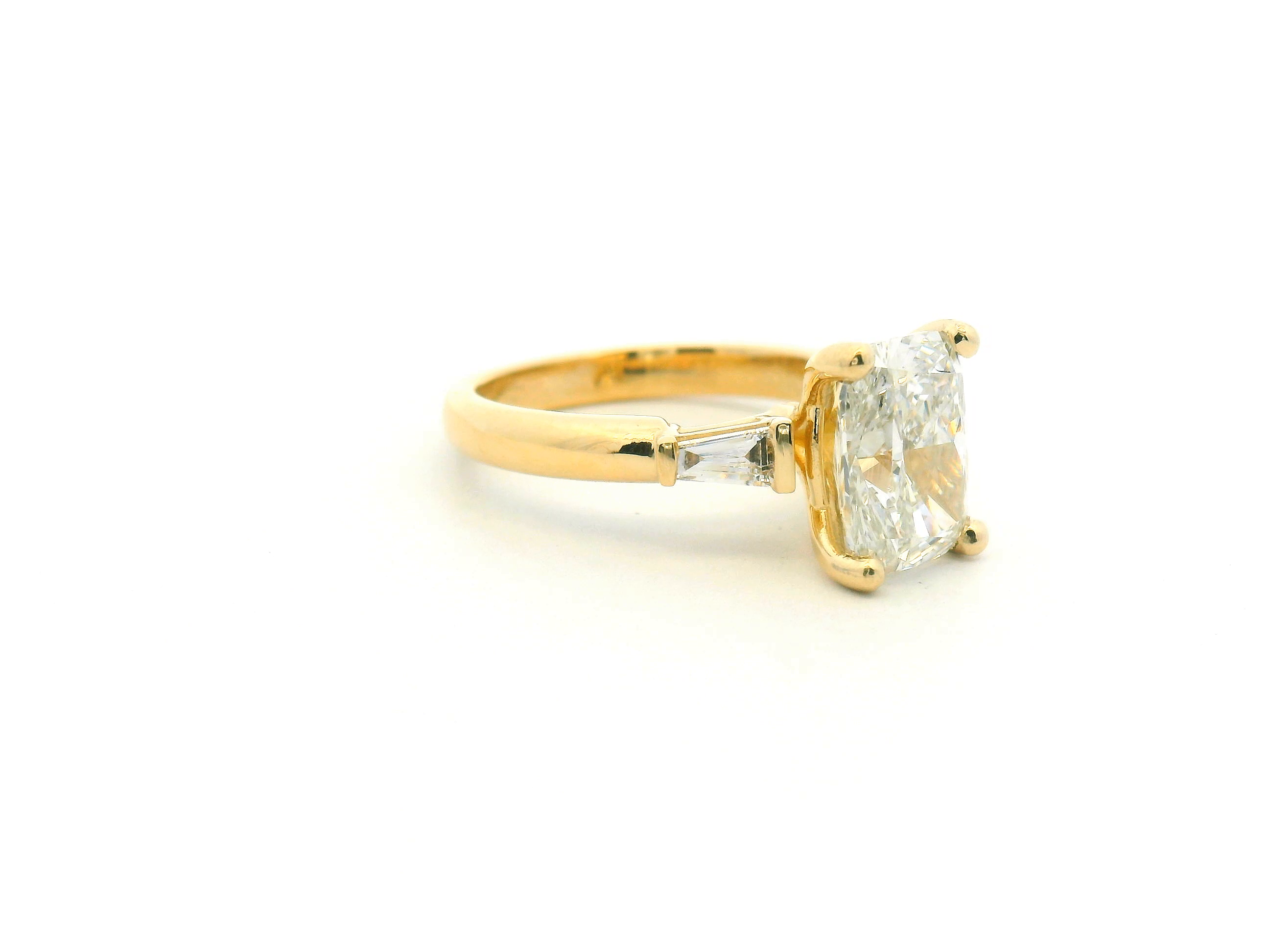 Elongated Cushion & Tapered Baguette Three-Stone Engagement Ring