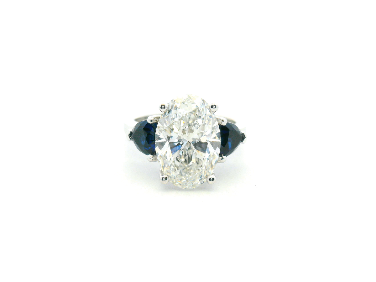 Oval Diamond & Trillion Sapphire Three-Stone Engagement Ring