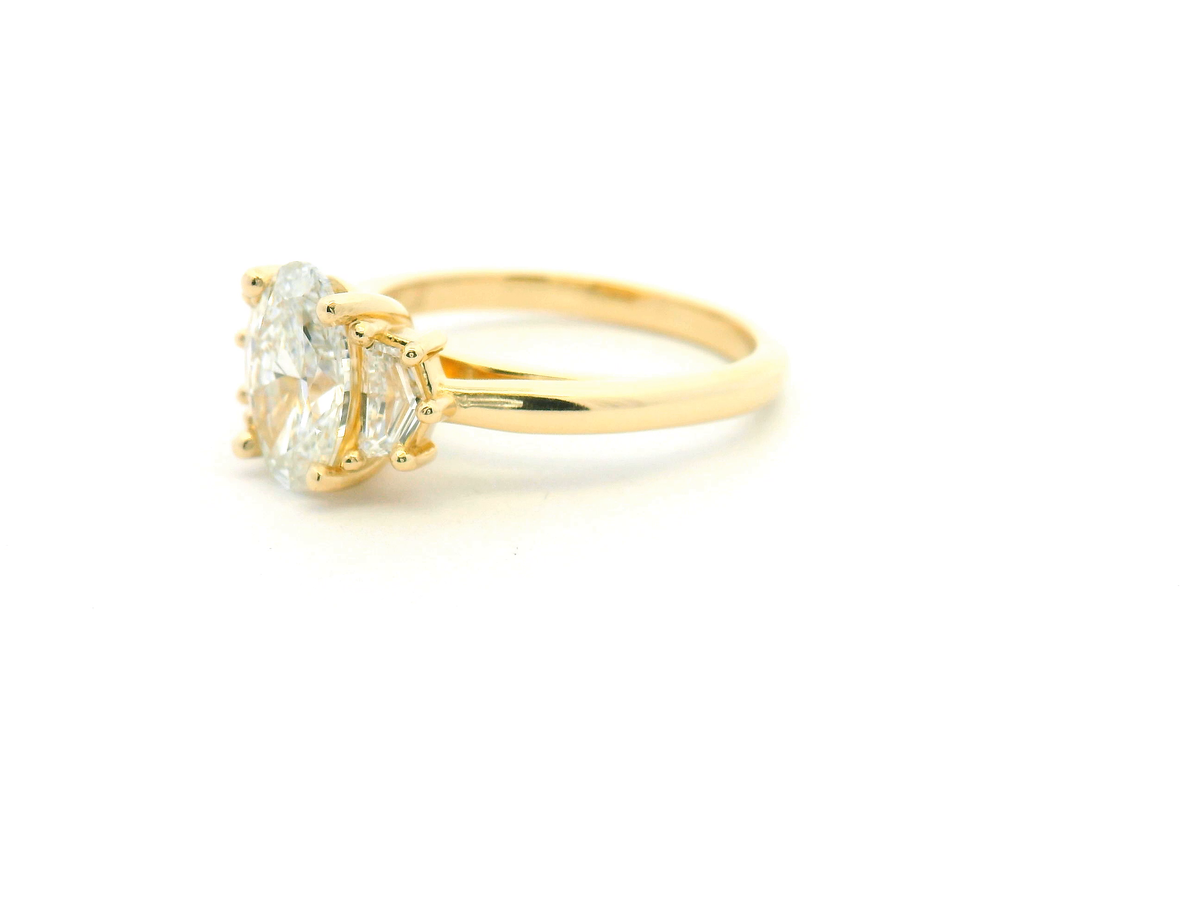 Oval Three-Stone Engagement Ring with Cadillac Side Diamonds