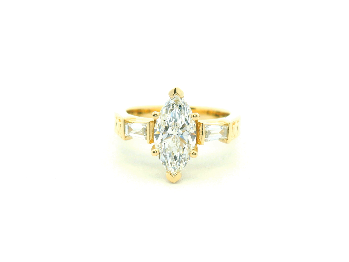 Marquise Diamond Three-Stone Engagement Ring with Tapered Baguettes