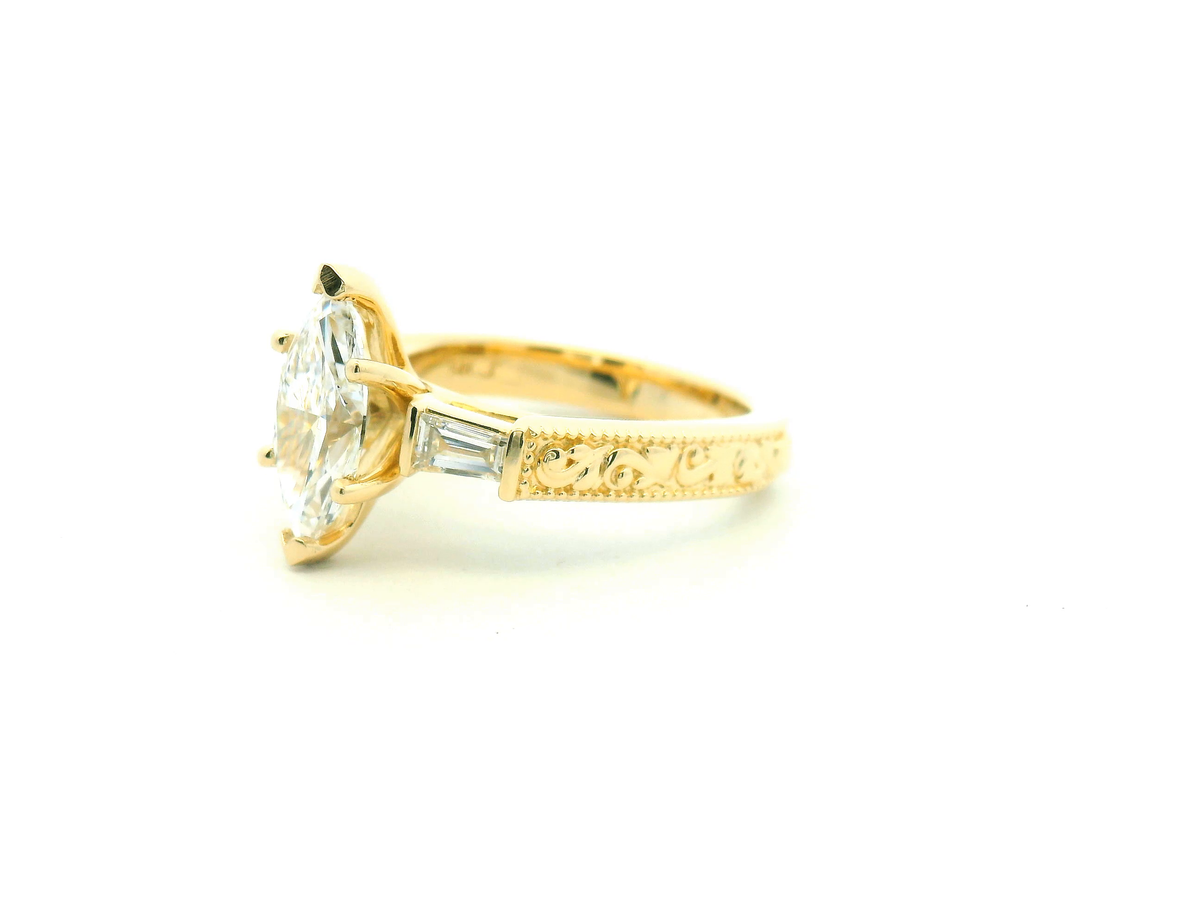 Marquise Diamond Three-Stone Engagement Ring with Tapered Baguettes