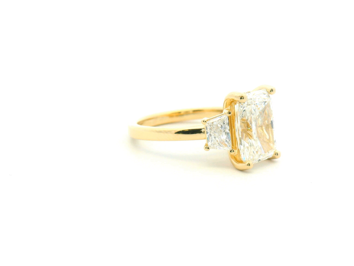 Three Stone Radiant Engagement Ring with Trapezoid Side Stones