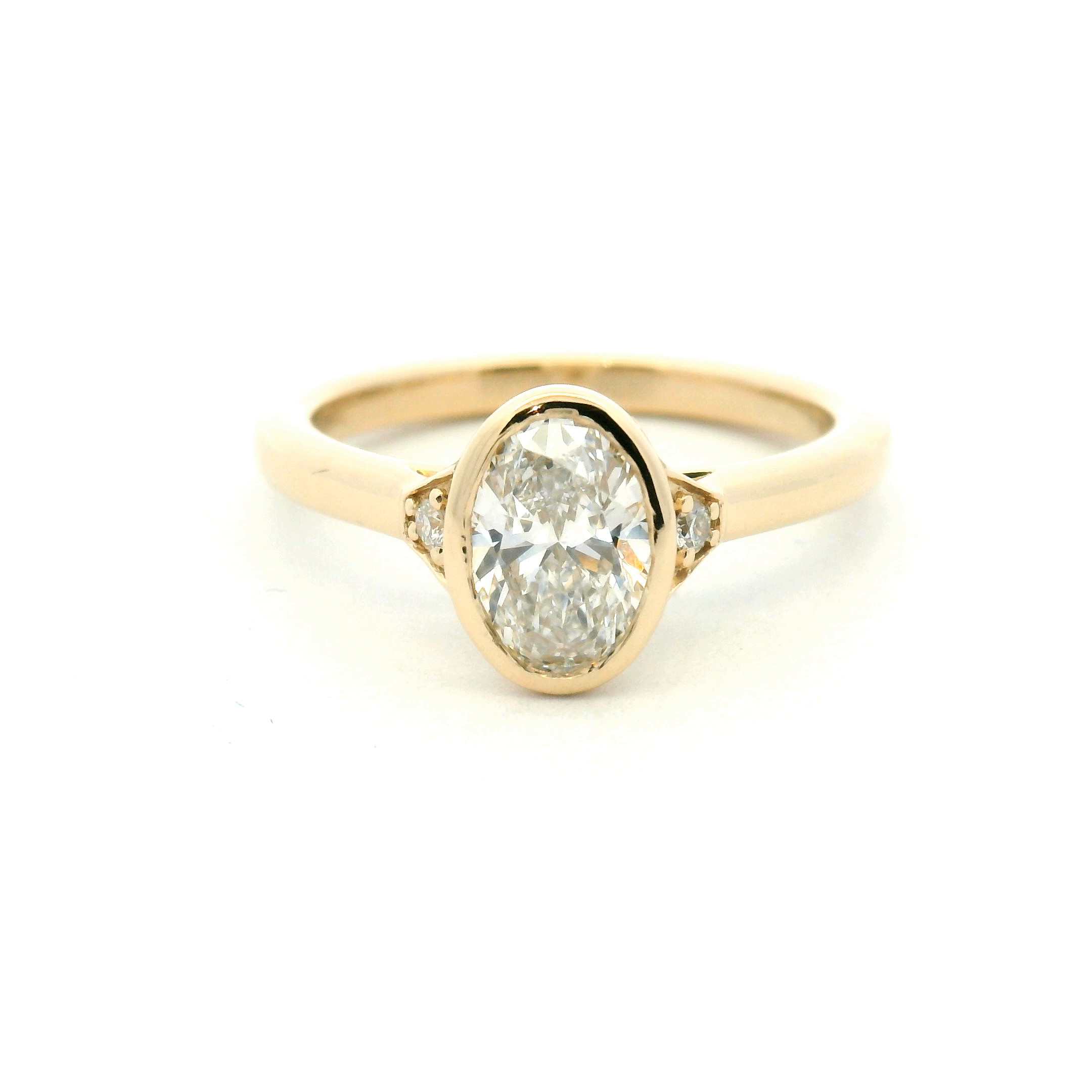Three Stone Bezel Set Oval Diamond Engagement Ring