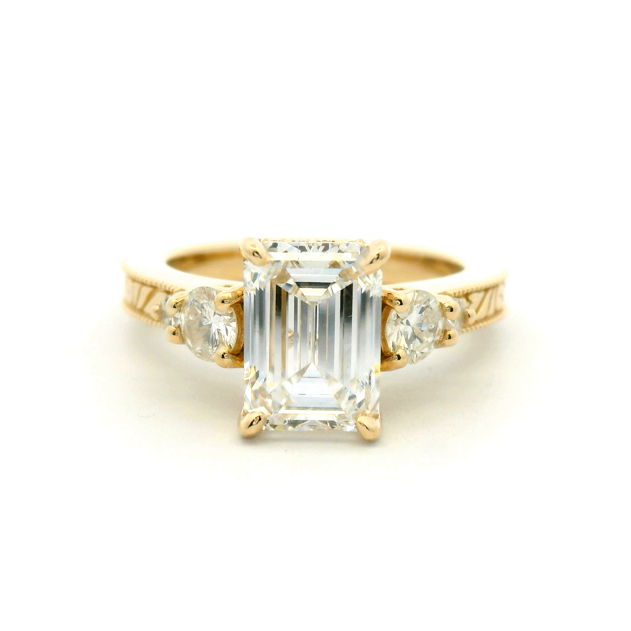 Five Stone Emerald Cut Engagement Ring with Engraved Band