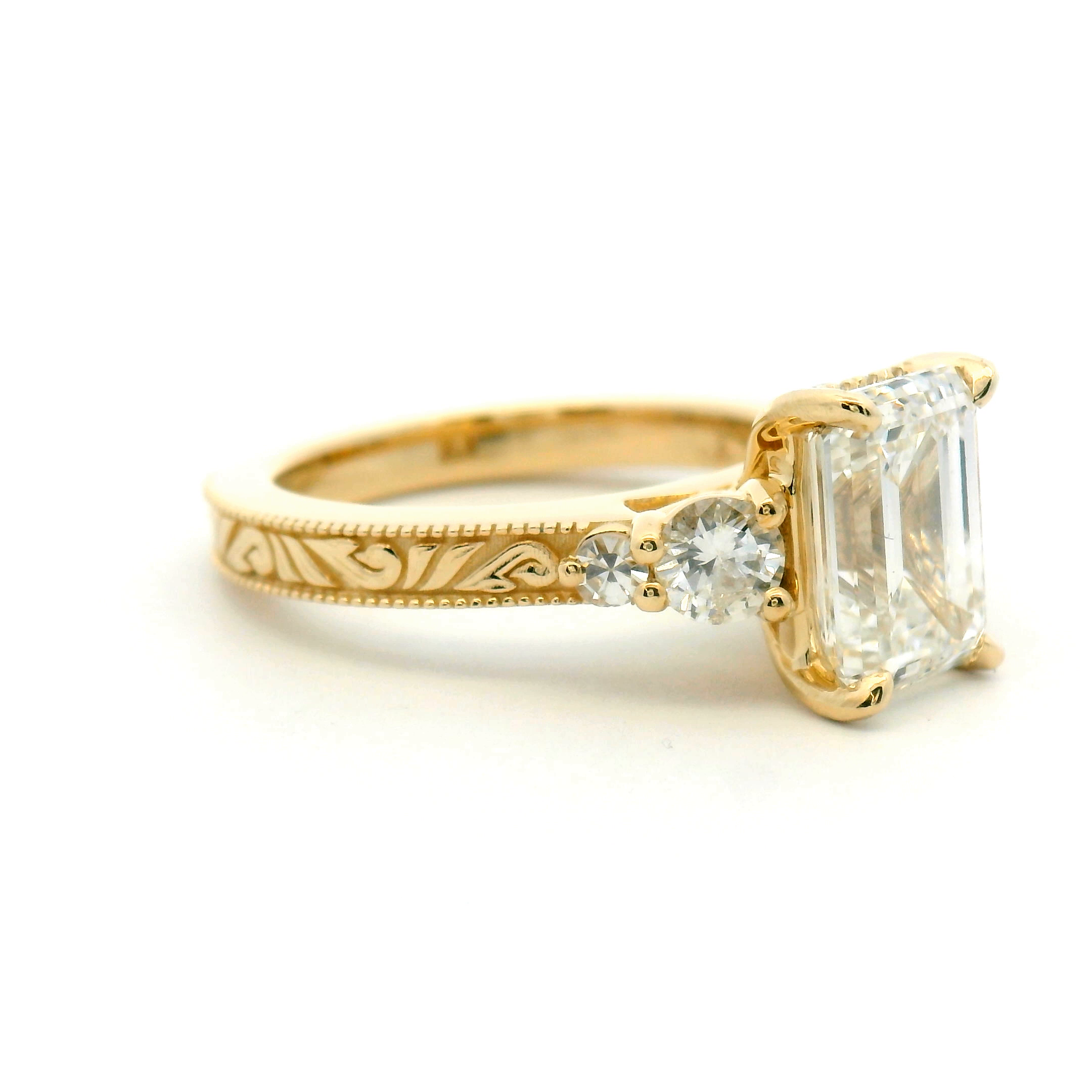 Five Stone Emerald Cut Engagement Ring with Engraved Band