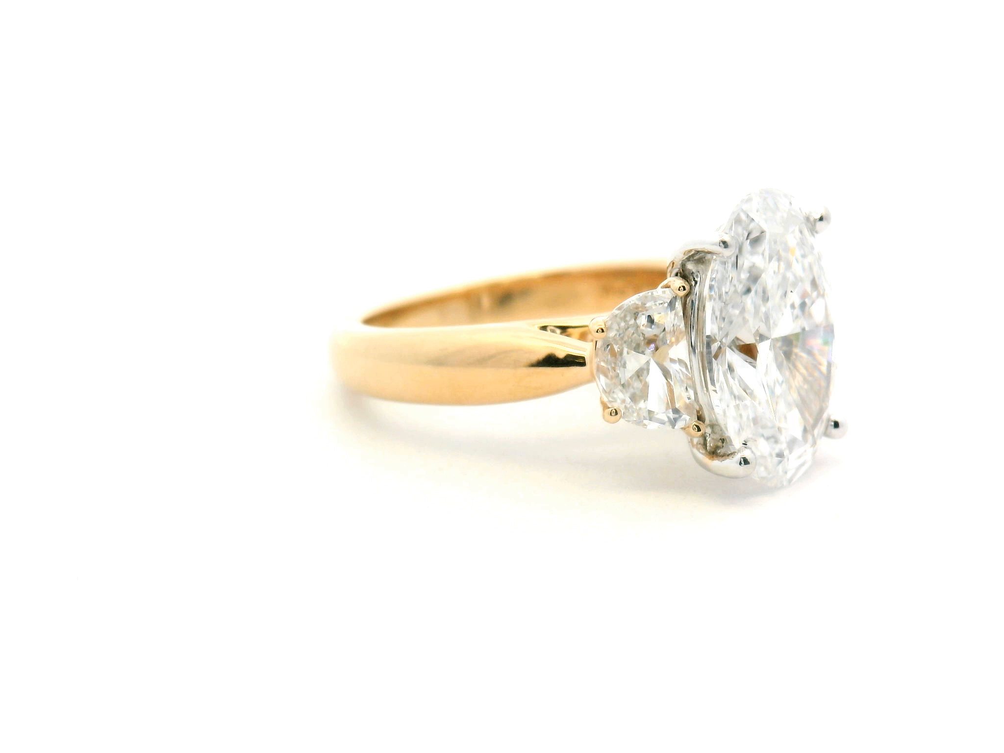 Oval Three-Stone Diamond Ring with Half Moon Sides
