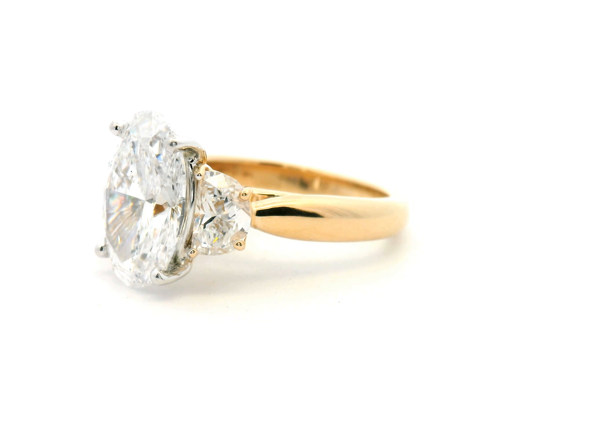 Oval Three-Stone Diamond Ring with Half Moon Sides