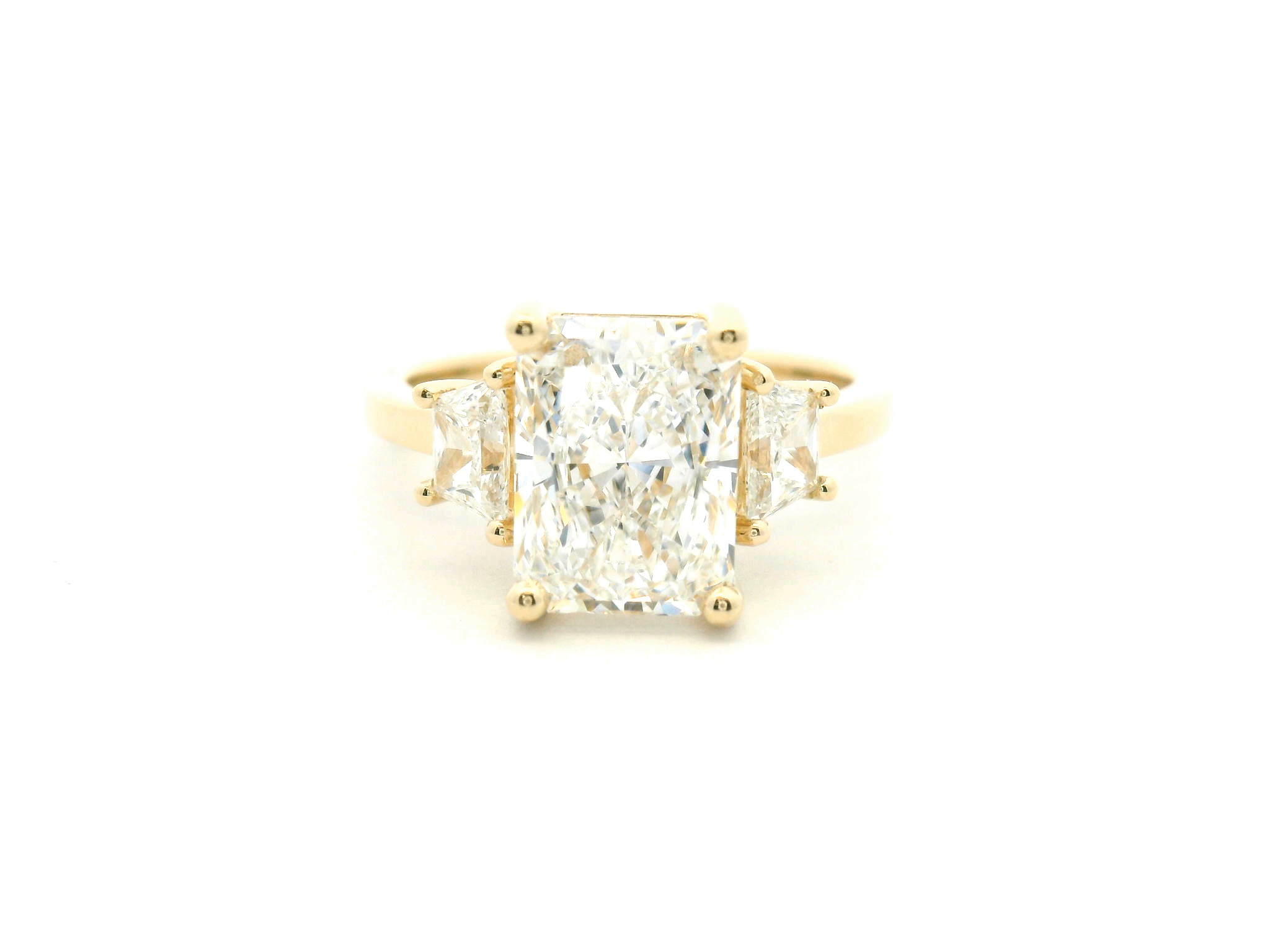 Radiant Cut Three-Stone Diamond Engagement Ring with Trapezoid Side Stones