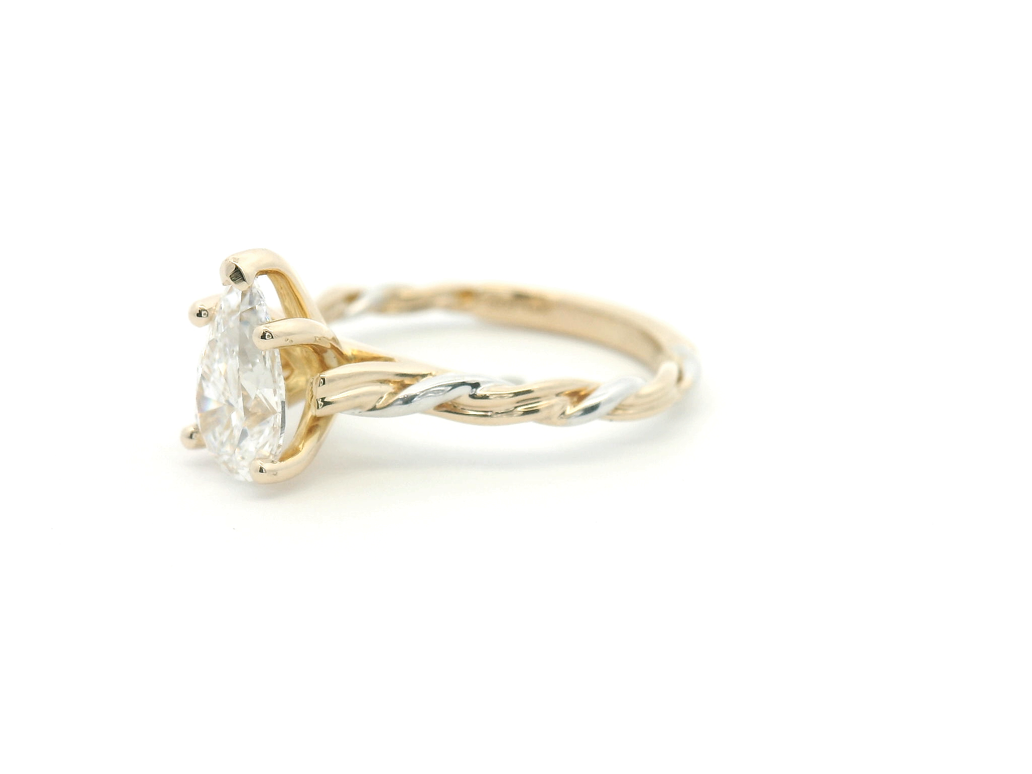 Pear Diamond Three Strand Twist Solitaire Ring