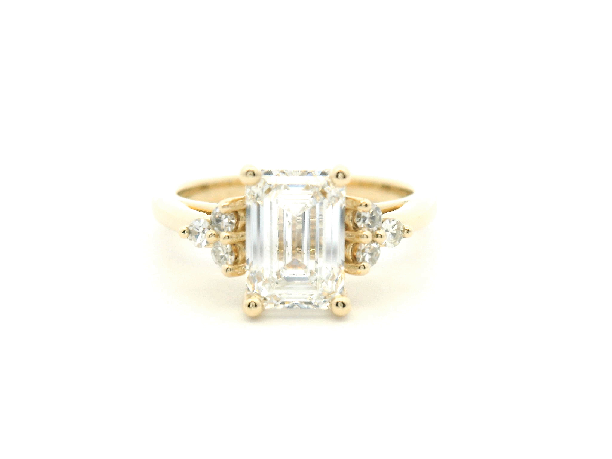 Emerald Cut Diamond Side Stone Cluster Engagement Ring