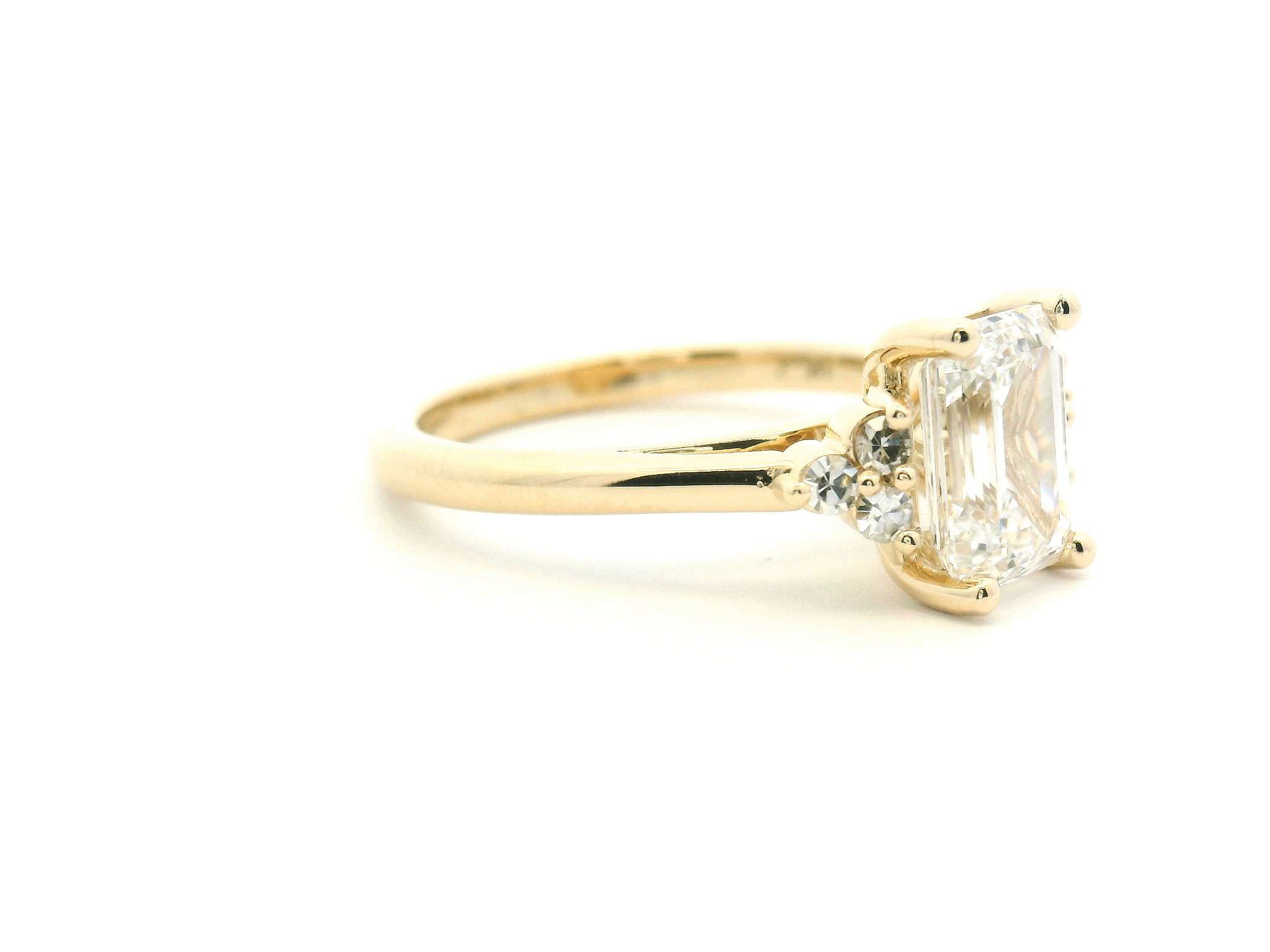 Emerald Cut Diamond Side Stone Cluster Engagement Ring