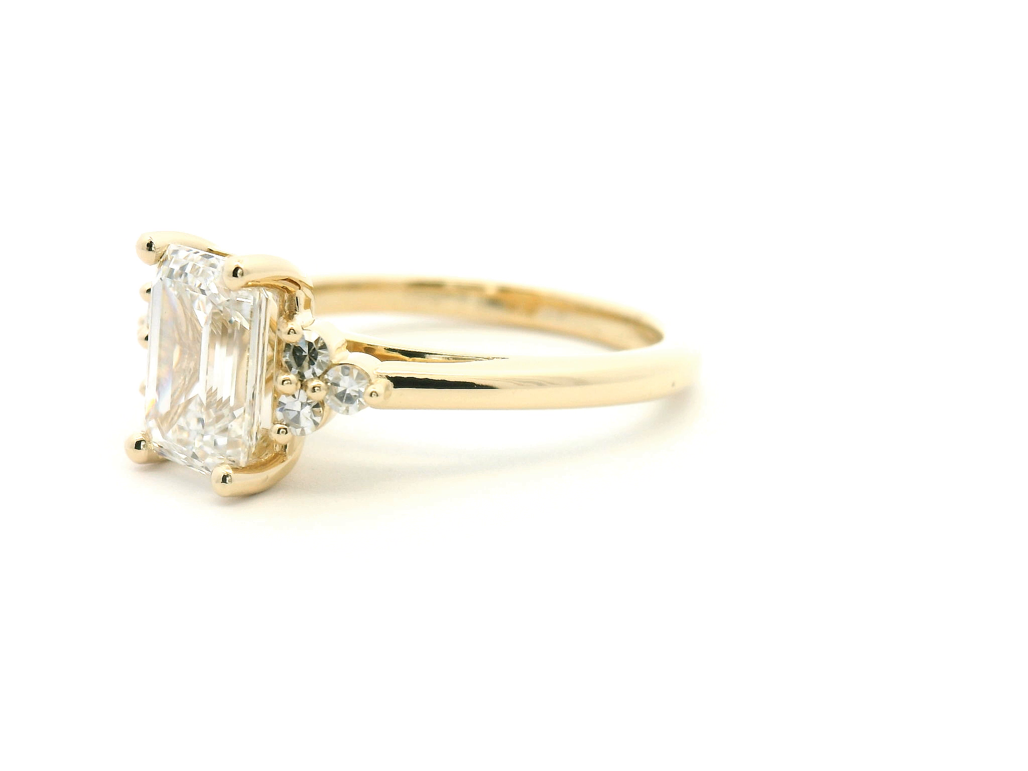 Emerald Cut Diamond Side Stone Cluster Engagement Ring