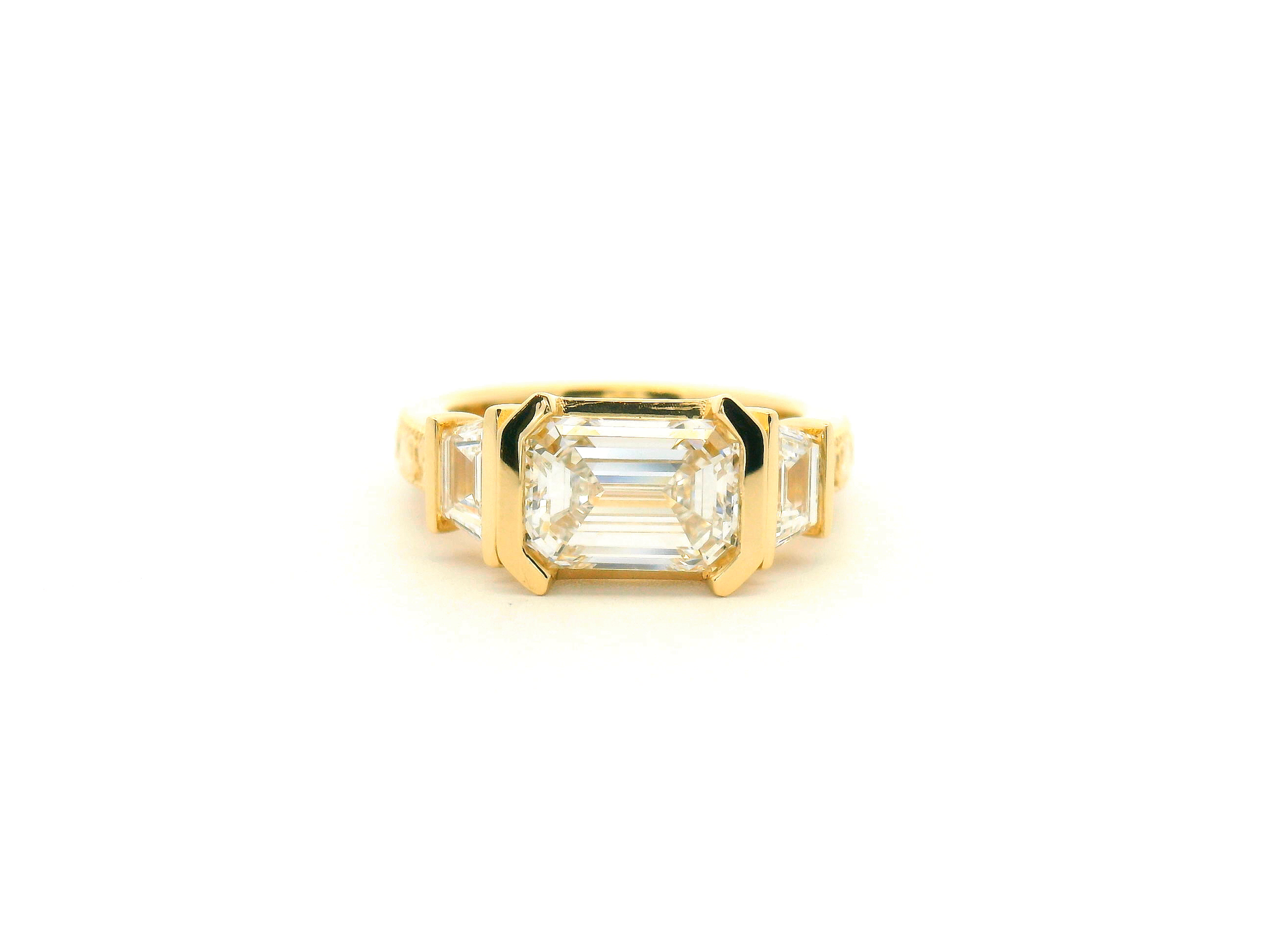 East-West Emerald Cut Three Stone Engagement Ring