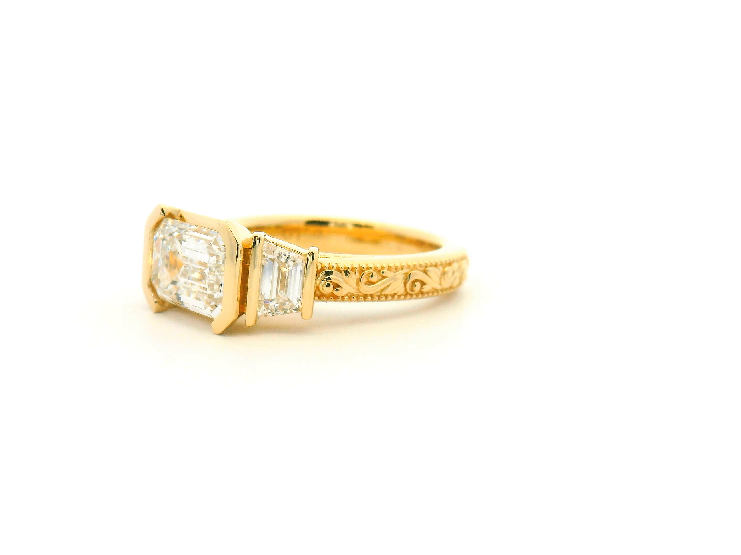 East-West Emerald Cut Three Stone Engagement Ring
