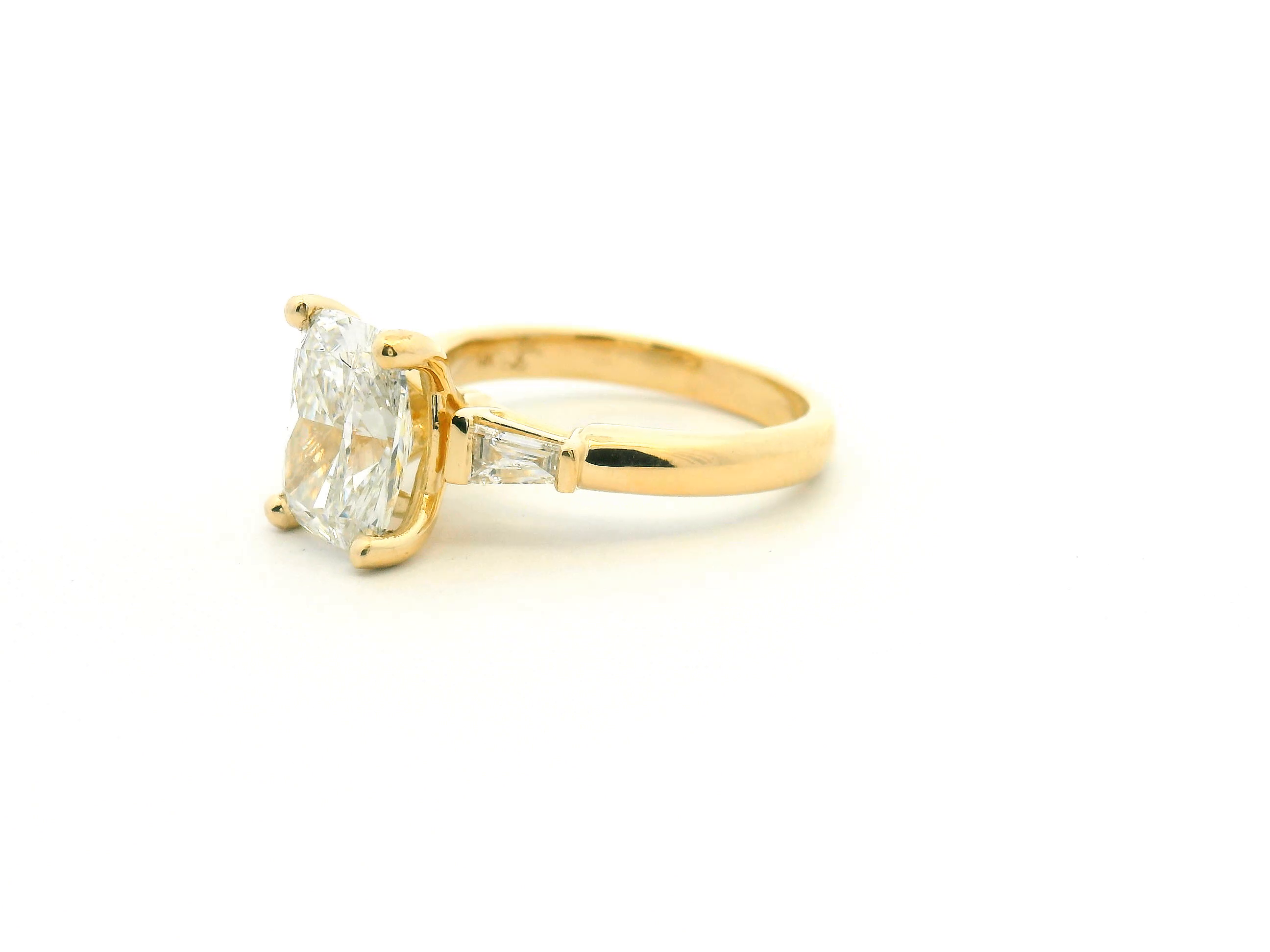 Elongated Cushion & Tapered Baguette Three-Stone Engagement Ring