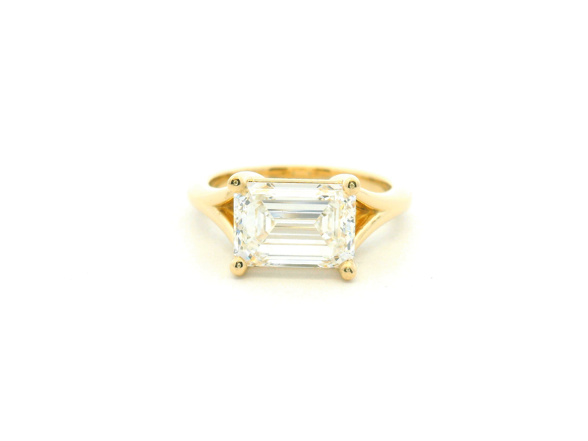 East-West Emerald Cut Split Shank Solitaire Engagement Ring