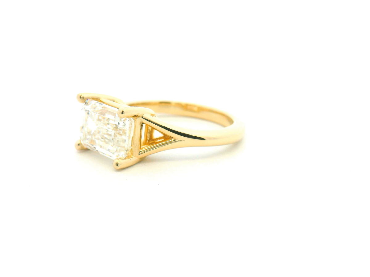 East-West Emerald Cut Split Shank Solitaire Engagement Ring