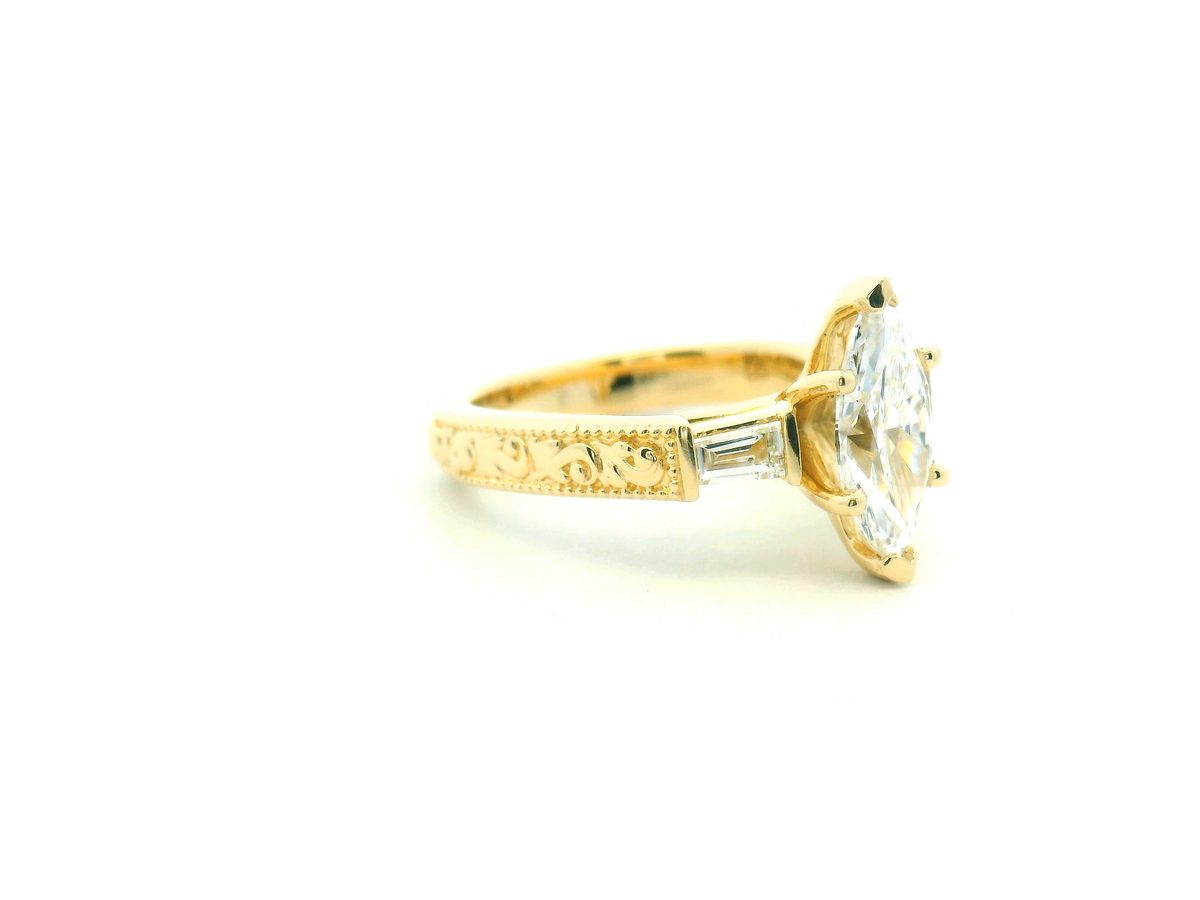 Marquise Diamond Three-Stone Engagement Ring with Tapered Baguettes