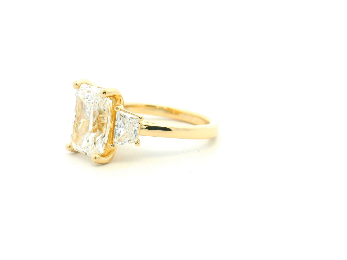 Three Stone Radiant Engagement Ring with Trapezoid Side Stones